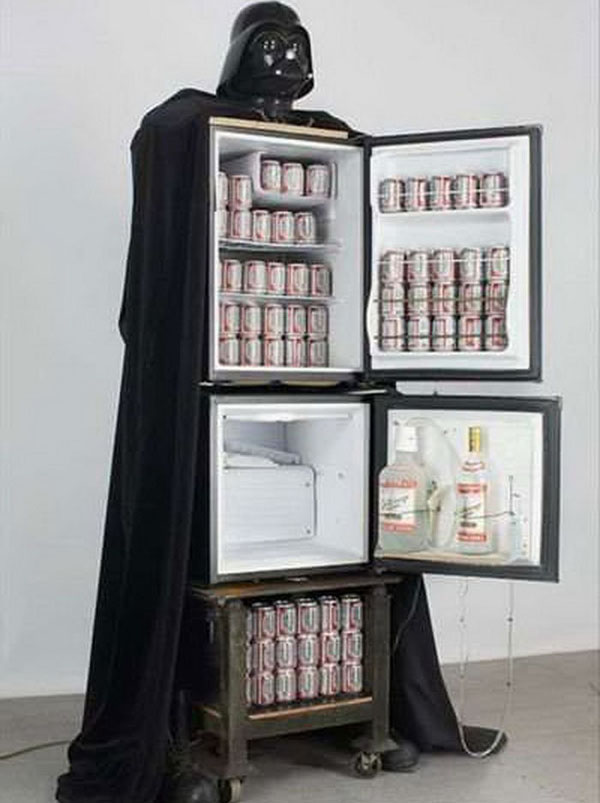 A Darth Vader fridge that is filled with an abundance of beer, making it a must-have for any passionate fan.