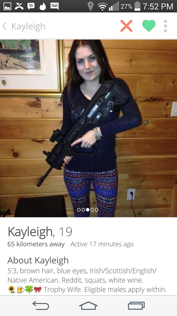 Our top Tinder find this week: a girl posing with a gun for a picture.