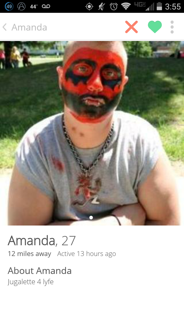Our Top Tinder Finds This Week: A man with a painted face on his phone.