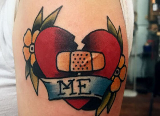 An unusual tattoo showcasing a heart adorned with a bandage.