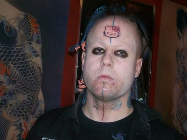 A man with a unique tattoo on his face.