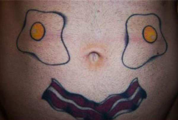 A belly tattoo featuring bacon and eggs that induces feelings of positivity.