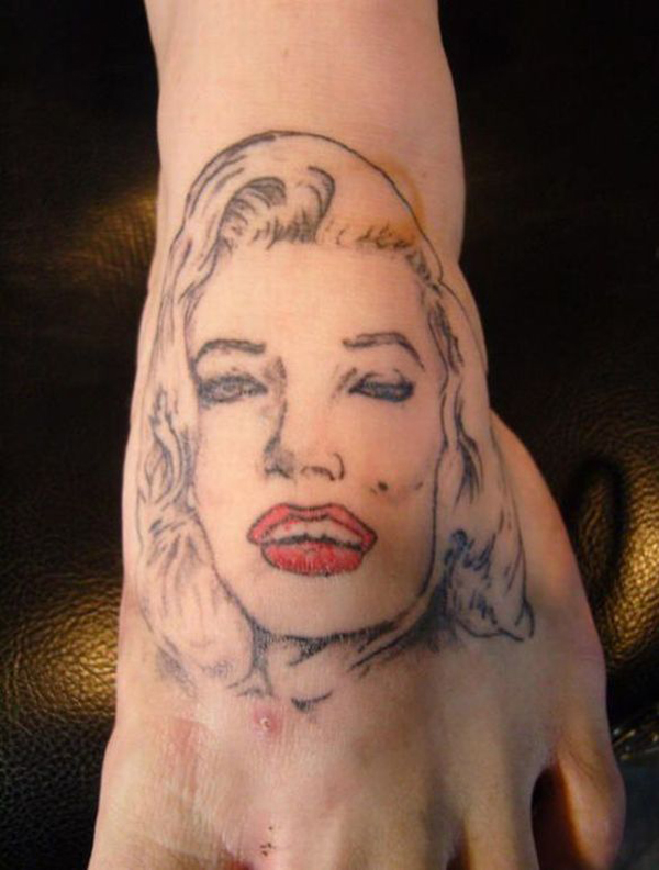 A Marilyn Monroe tattoo on a woman's foot for an empowering boost.