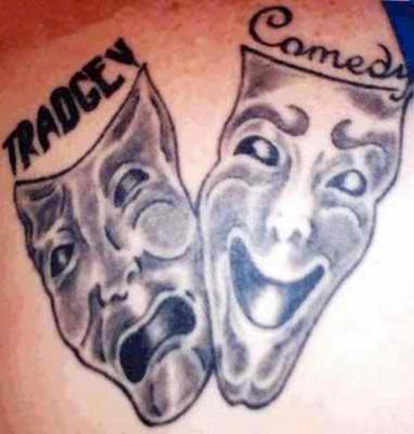 A tattoo of two masks on a person's back that aims to make you feel better about your life.