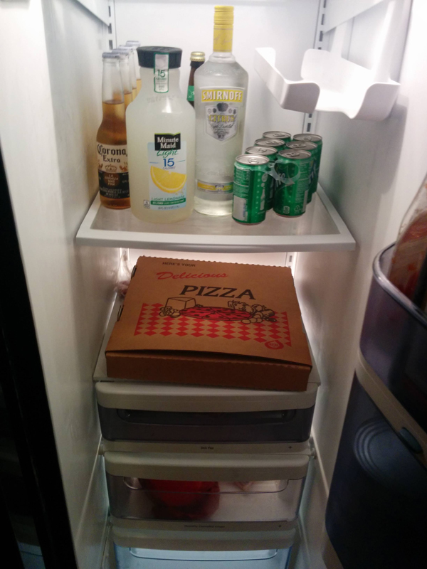 A fridge defining who you are based on its contents – including a pizza box.