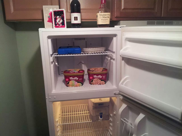 A refrigerator revealing a wine bottle reflects your personality based on its contents.