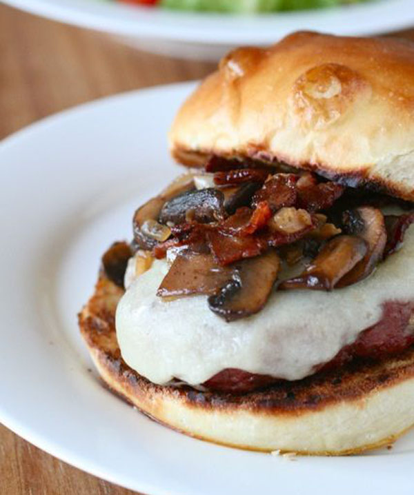 An awesome visual suggestion for a Super Bowl burger: mushrooms and cheese on a plate.