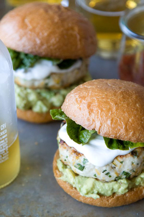 Awesome Super Bowl burgers with guacamole and sour cream.
