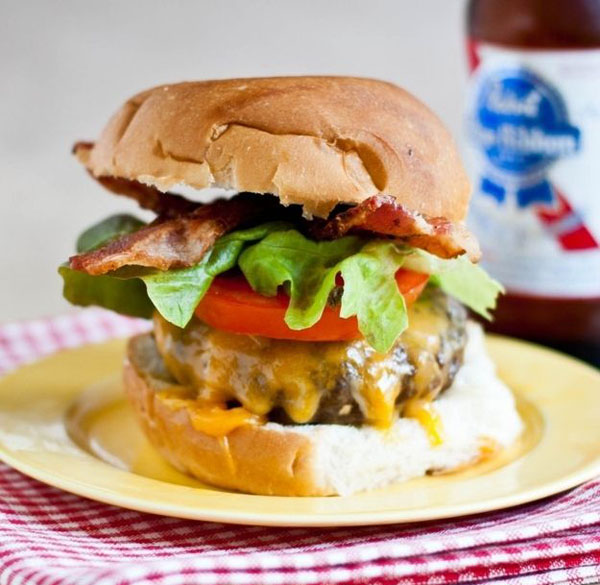 Visual suggestion: A visually stunning burger with bacon, lettuce, and tomatoes - perfect for Super Bowl.