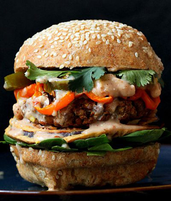 A visually appealing Super Bowl burger with a tasty sauce.