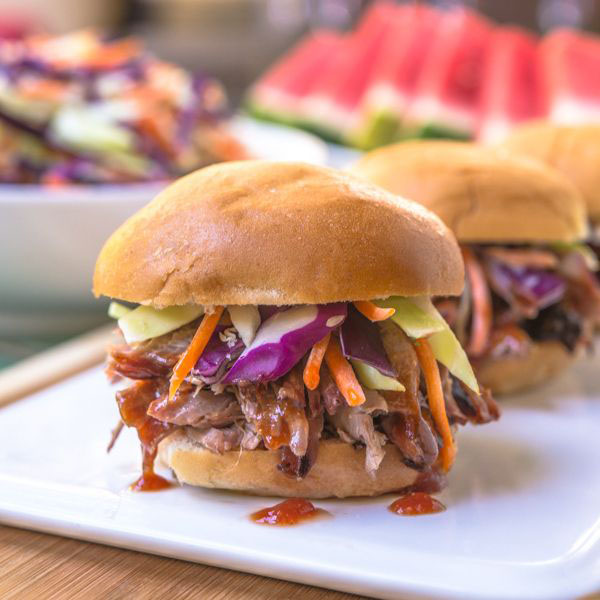 Super Bowl sliders featuring pulled pork, coleslaw, and watermelon.