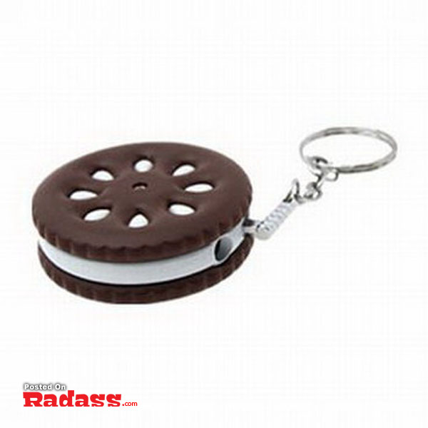An Oreo cookie key chain is displayed on a white background, adding style to your everyday accessories.
