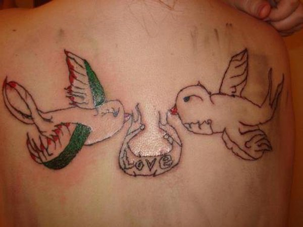 A woman's tattooed back showcases two birds amidst poor choices, often leading to hilarious conclusions.