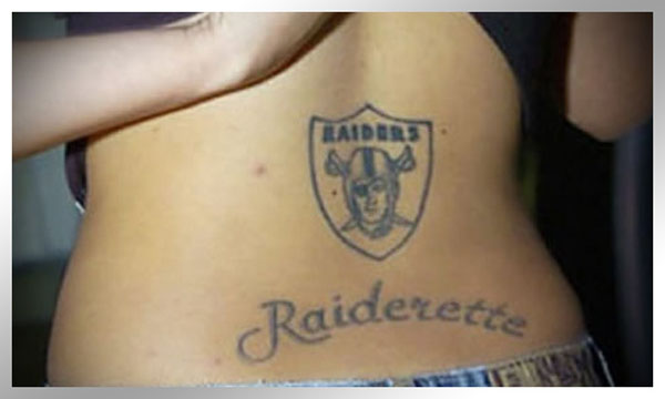 A woman's back adorned with an Oakland Raiders tattoo, featured among 20 terrible tattoos that will make you happy you are you.