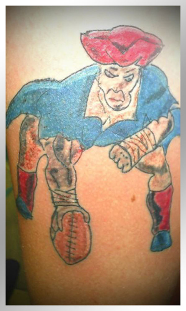 A terrible tattoo of a football player with a red cap.