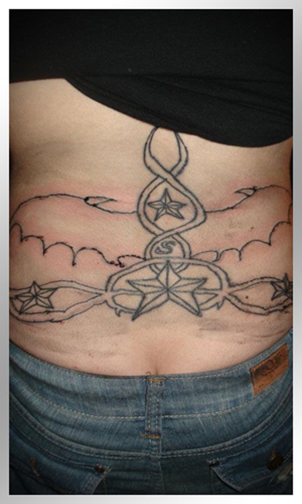 A woman's back showcasing a tattoo.