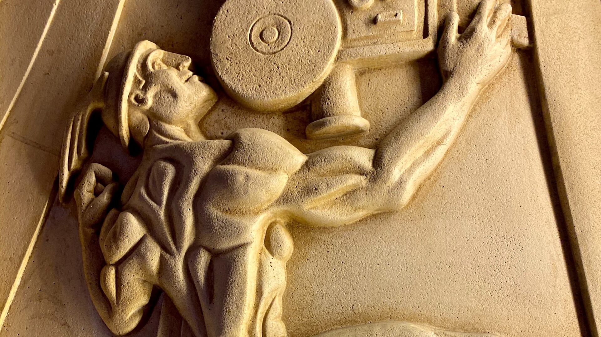 A weightlifting man holding a camera, evoking the empowering essence of Greek gods.