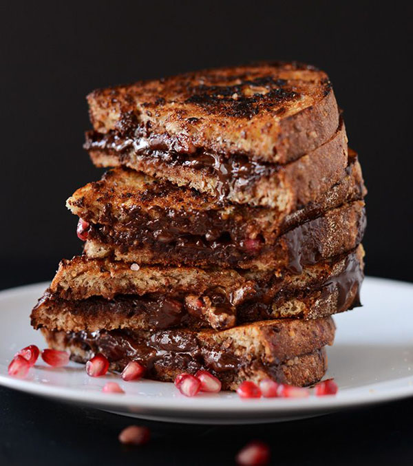 A stack of tantalizing chocolate and pomegranate grilled cheese on a plate, food porn alert!