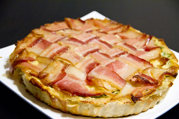 A tantalizing pie topped with crispy bacon.