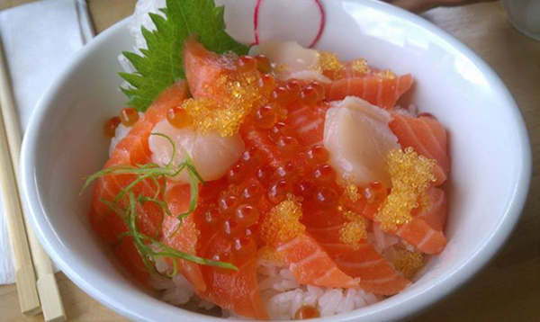 A bowl of salmon and rice ready to satisfy your hunger.