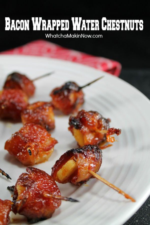 Game day appetizer: Bacon wrapped water chestnuts on a plate.