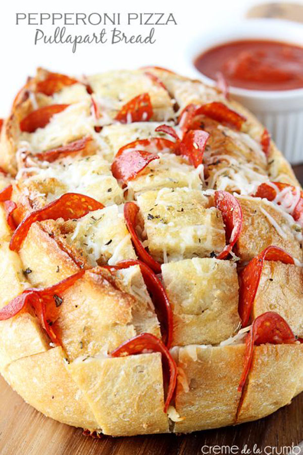 Game Day Grub Idea: Pepperoni pizza puffed bread on a cutting board.