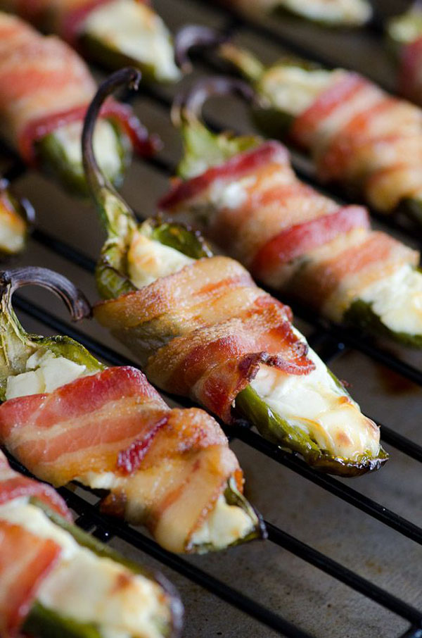 Game Day Grub Ideas: Bacon wrapped jalapenos, in honor of football.