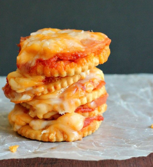 Game Day Grub Ideas: A stack of pizza crackers stacked on top of each other, perfect for football season.