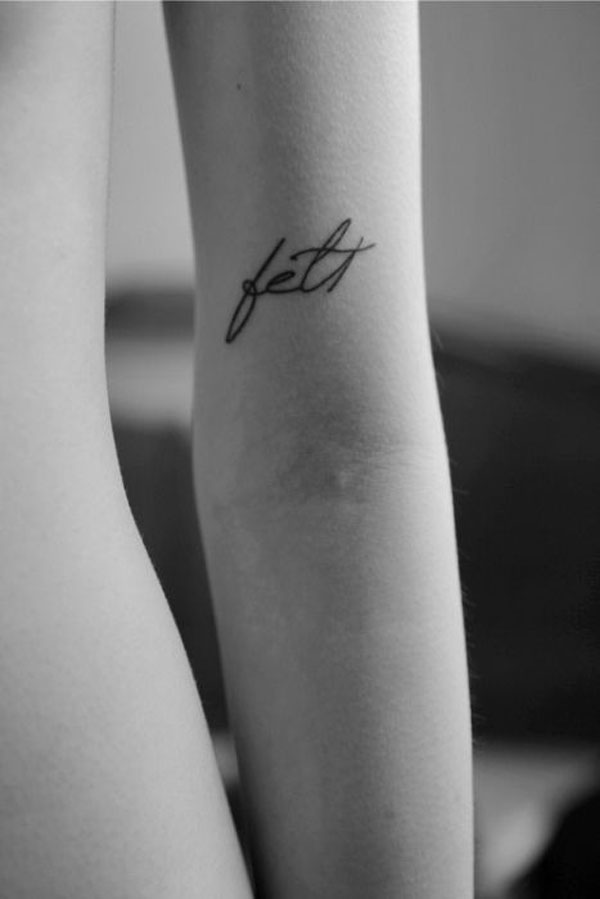 Black and white photo, woman's tattoo.