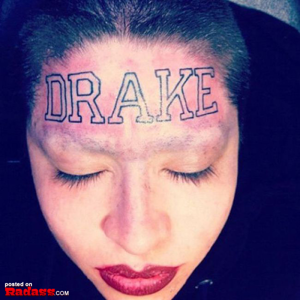 A woman with a permanent tattoo on her head that says drake, showcasing the lasting impact of tattoos.