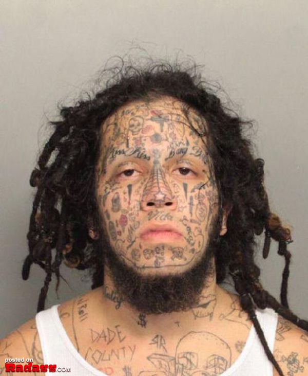 A man with regrettable tattoos on his face.