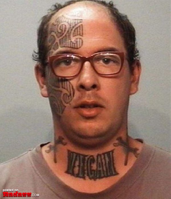 A man with a regrettable neck tattoo.