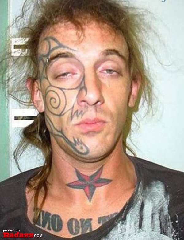 A man with regrettable face tattoo.