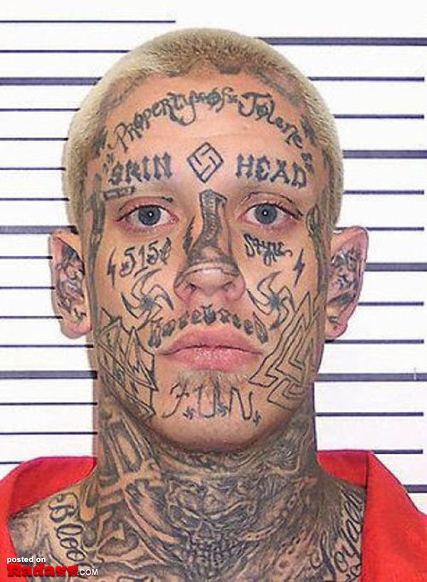 A man with regrettable face tattoos.