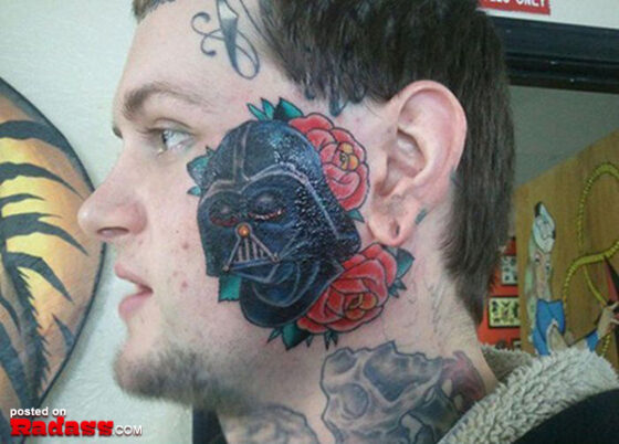 A man with a regrettable darth vader tattoo on his face.