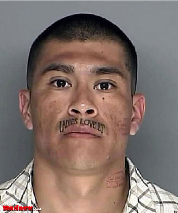 A man with a regrettable face tattoo.
