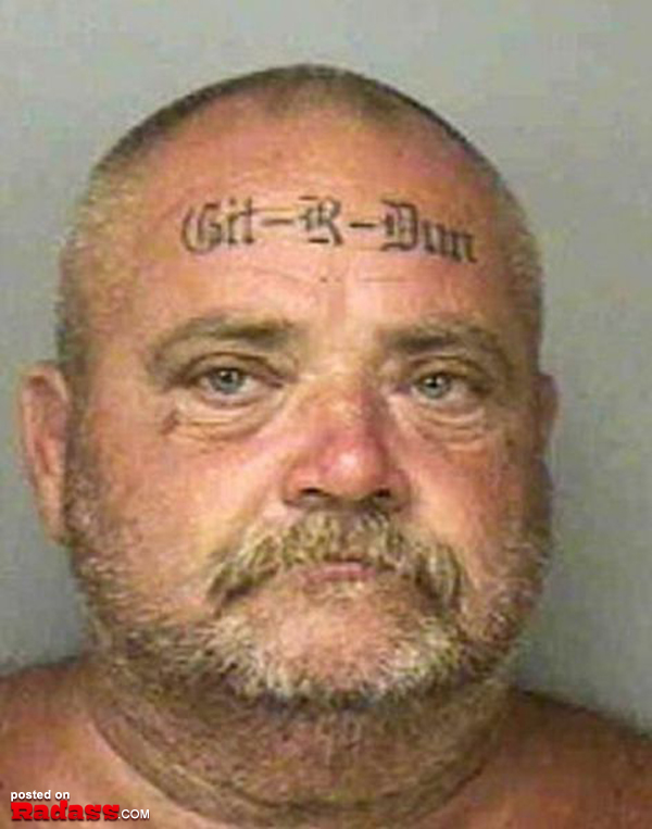 A man with a regrettable head tattoo.