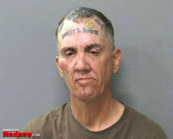 A man with a regrettable tattoo on his head.