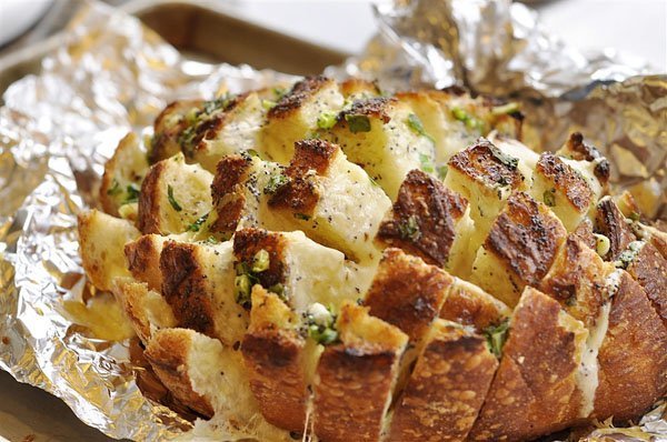 A decadent loaf of bread on a baking sheet that screams 