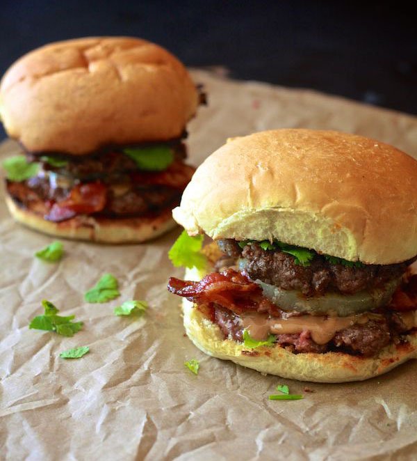 Two juicy burgers tantalizingly tempt on a mouthwatering paper platter - OM-F@cking-G food porn!