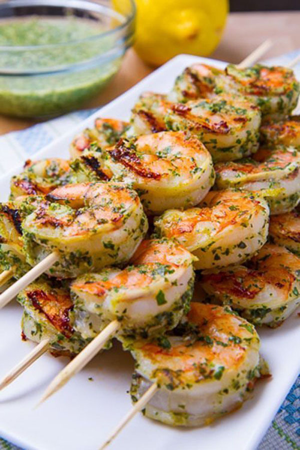 OM-F@cking-G Shrimp skewers with pesto sauce on a white plate that is pure Food Porn.