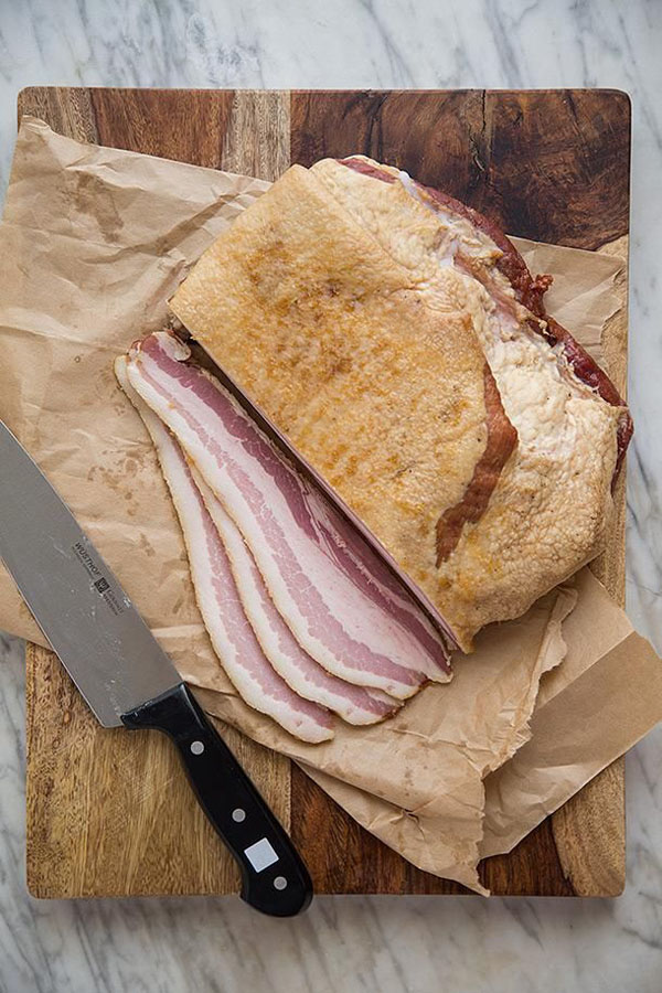 Sliced ham on a cutting board.