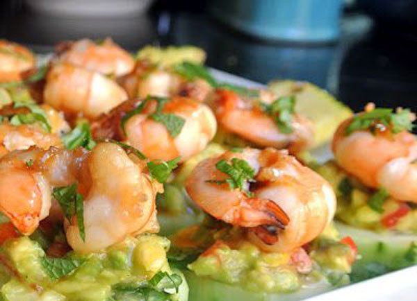 Shrimp and avocado plated in mouthwatering food porn.