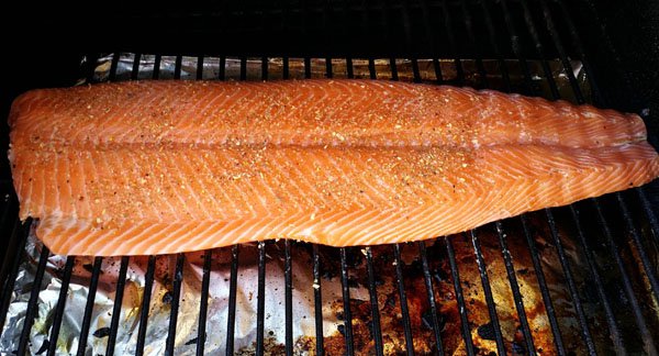 OMG - A mouthwatering piece of salmon sizzling on a grill is food porn.