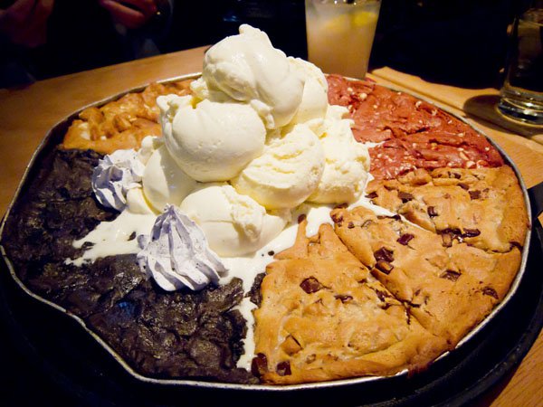 OM-F@cking-G, indulge in this food porn extravaganza featuring pizza, ice cream, and cookies harmoniously piled on top!