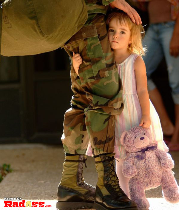 A young American girl holding a teddy bear.