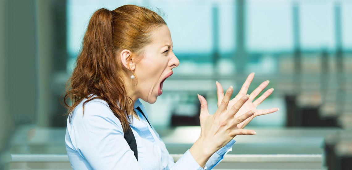 A woman expressing her deal-breaker in an airport.