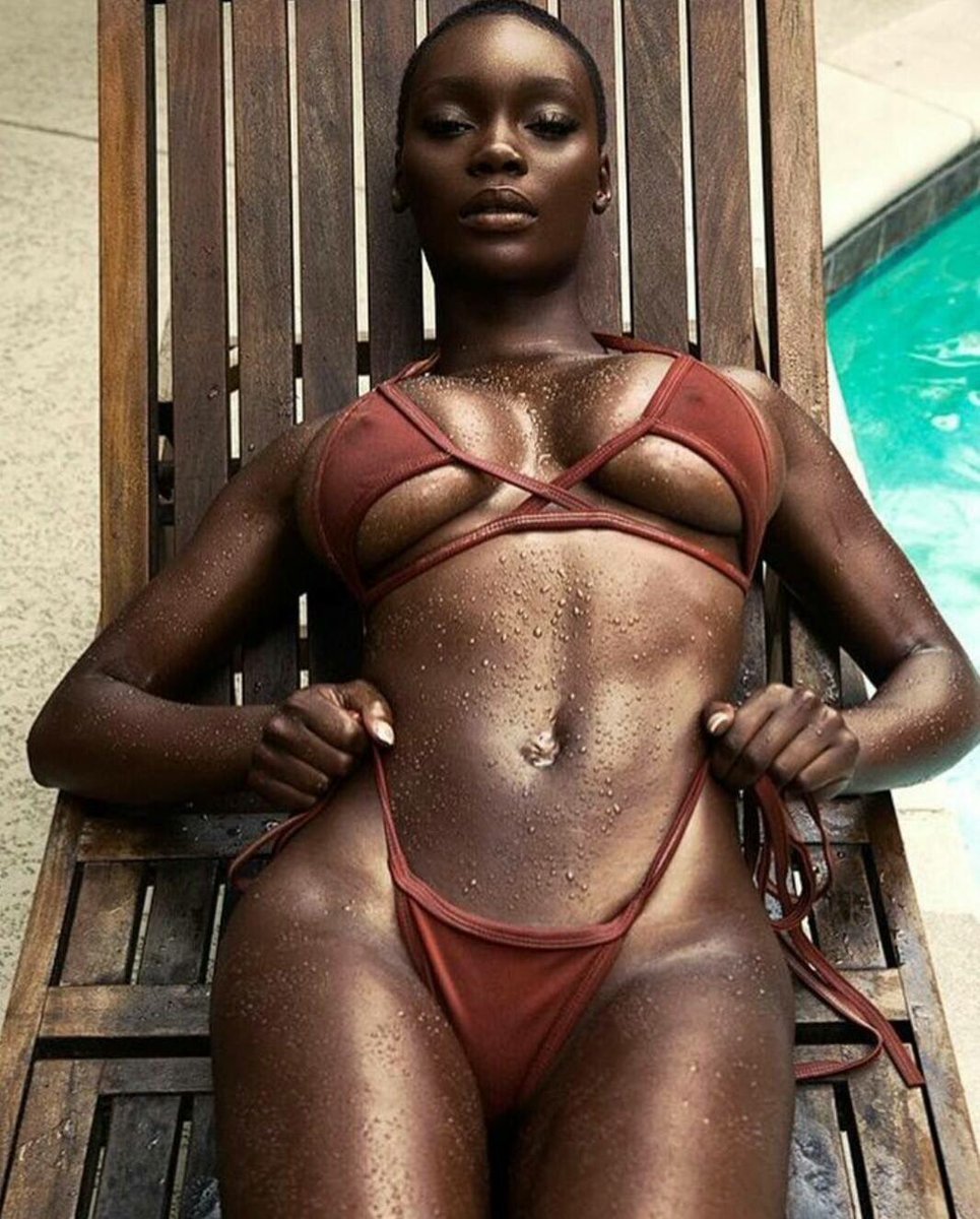 A woman in a brown bikini, showcasing The Many Shades of Instagram as she lounges on a wooden chair.