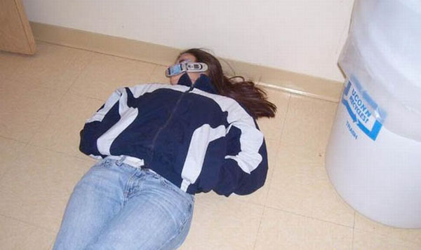 A woman posing on the floor with a mask on during a wild weekend.