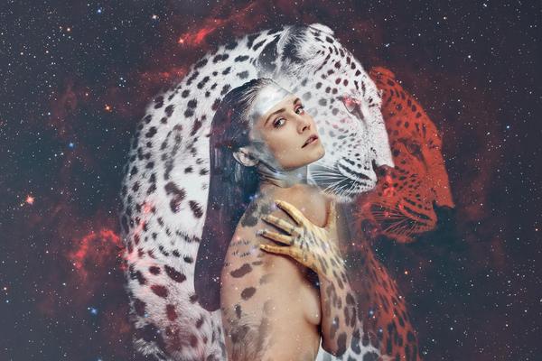 An image of a woman with a leopard, showcasing the connection to your inner animal.